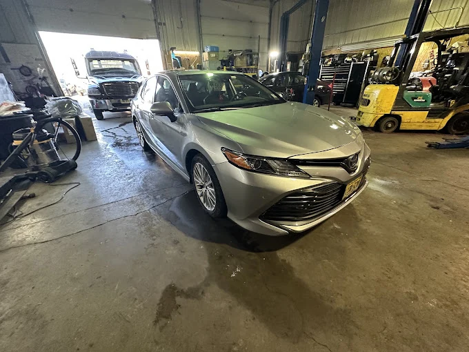 Silver sedan inside the Southside workshop.